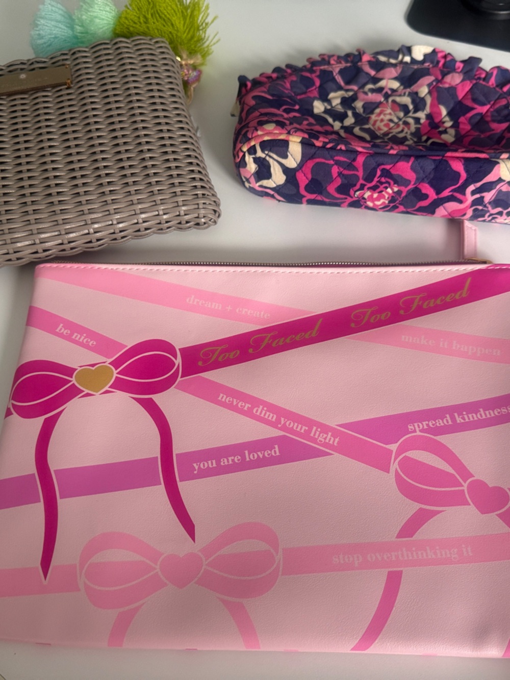 Set of makeup bags. One is Vera Bradley, Too Faced, and Squeeze De Citron